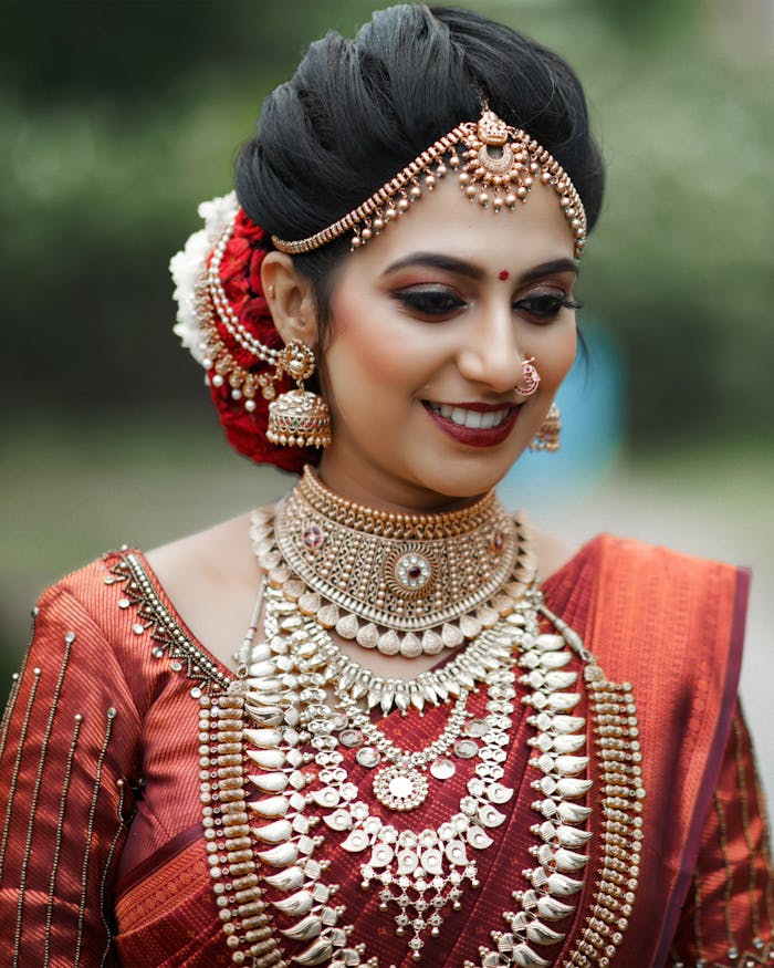 Beautiful Indian bride adorned with traditional jewelry and attire, radiating elegance.